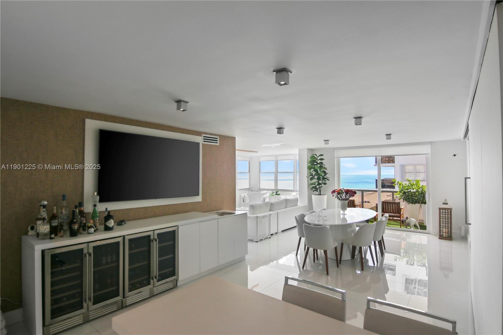 6039 Collins Avenue, Unit 1402 Miami Beach, FL 33140 - Photo 12 of 45 a view of a dining room with furniture window and outside view