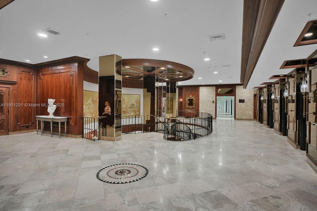 6039 Collins Avenue, Unit 1402 Miami Beach, FL 33140 - Photo 42 of 45 a view of a lobby with furniture