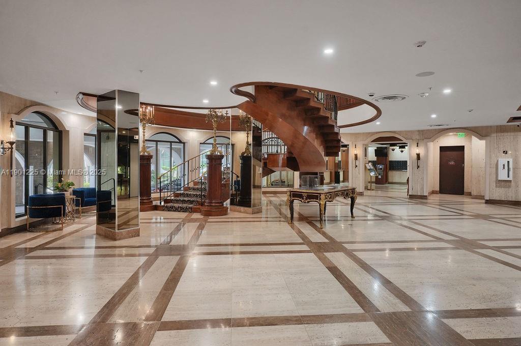6039 Collins Avenue, Unit 1402 Miami Beach, FL 33140 - Photo 44 of 45 a view of a lobby with black and white walls
