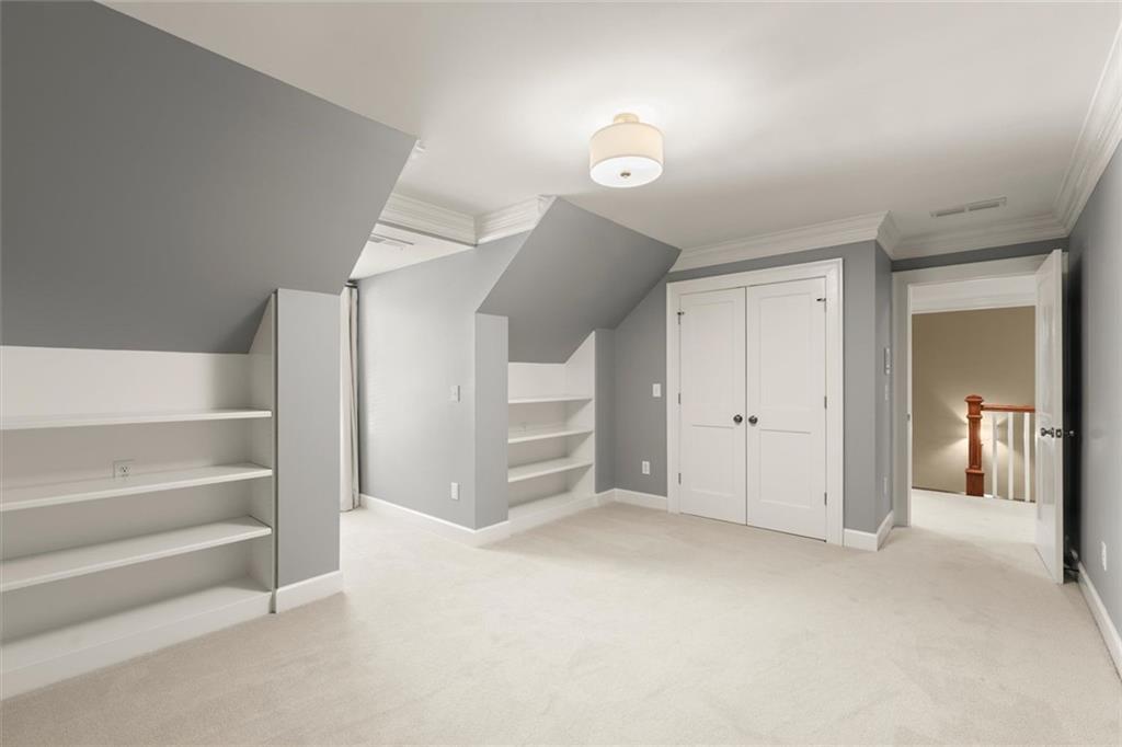 1450 Acworth Due West Road Northwest Kennesaw, GA 30152 - Photo 46 of 77 a view of an empty room with a cabinet and stairs