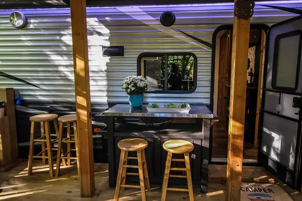 a kitchen view with table and chairs