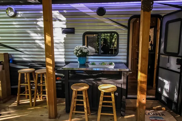 a kitchen view with table and chairs