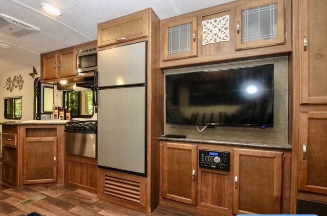 85 27th Street Ellijay, GA 30540 - Photo 28 of 28 a kitchen with stainless steel appliances granite countertop a refrigerator a stove and a sink with wooden floor