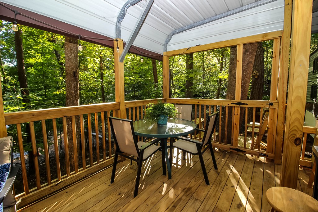 85 27th Street Ellijay, GA 30540 - Photo 6 of 28 a view of a chairs and table in the balcony