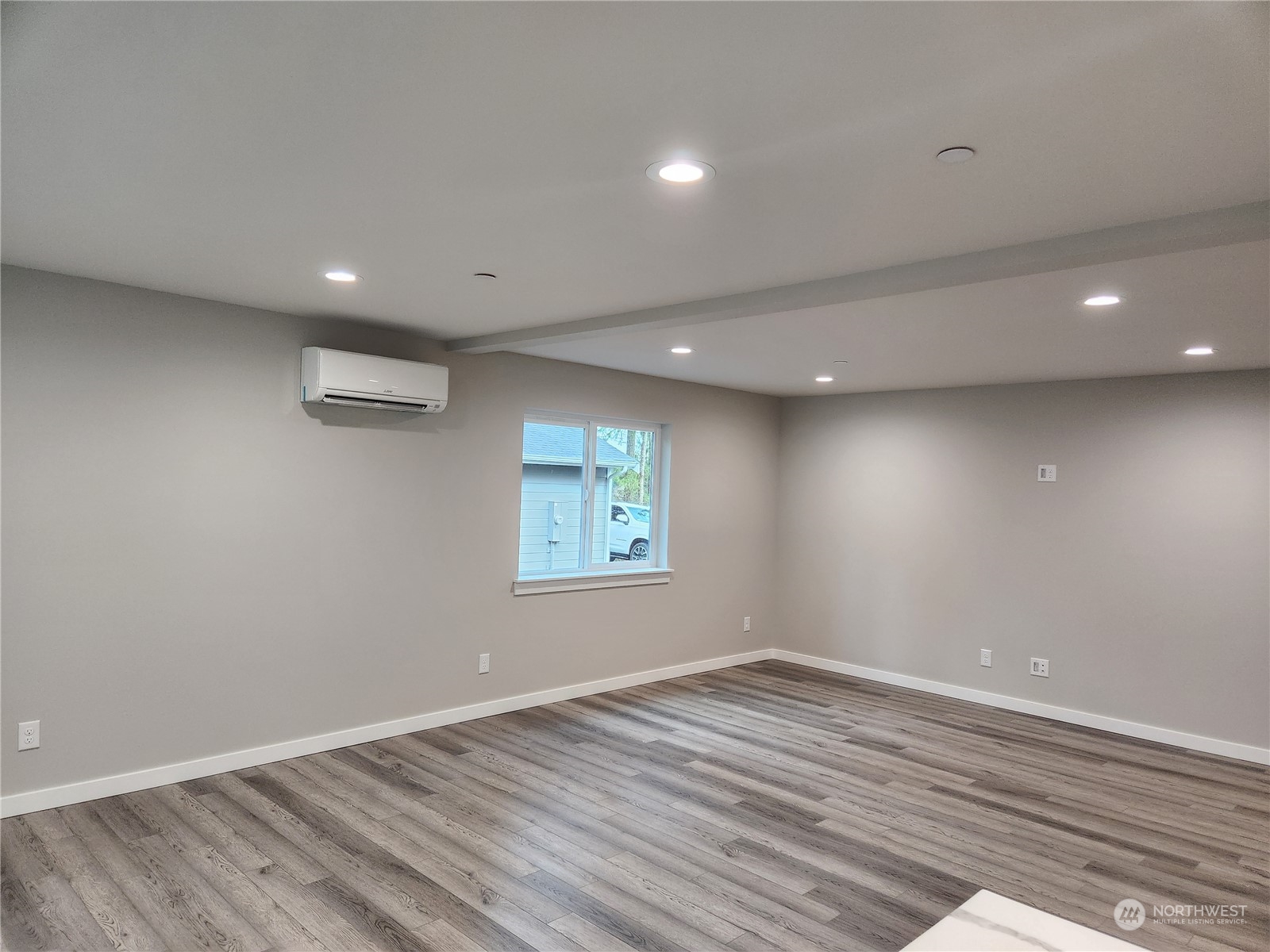 5948 Sidney Road Southwest Port Orchard, WA 98367 - Photo 4 of 10 an empty room with wooden floor and windows