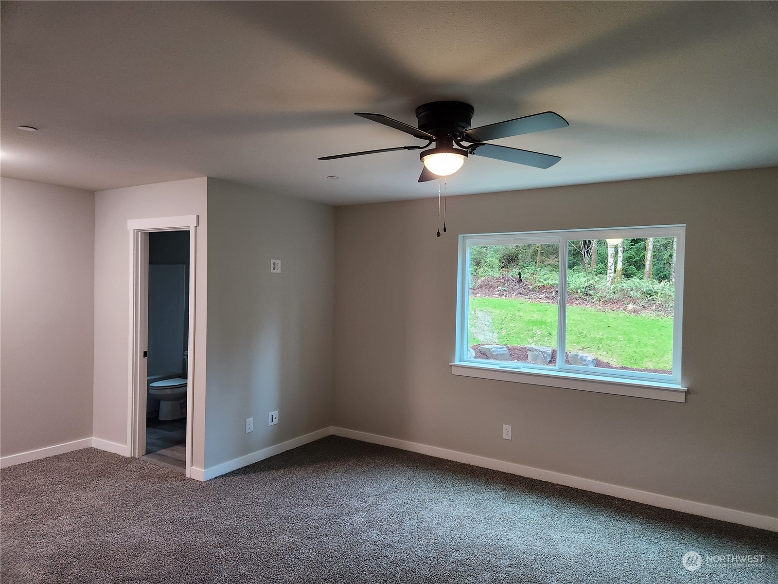 5948 Sidney Road Southwest Port Orchard, WA 98367 - Photo 8 of 10 an empty room with a window and a fan