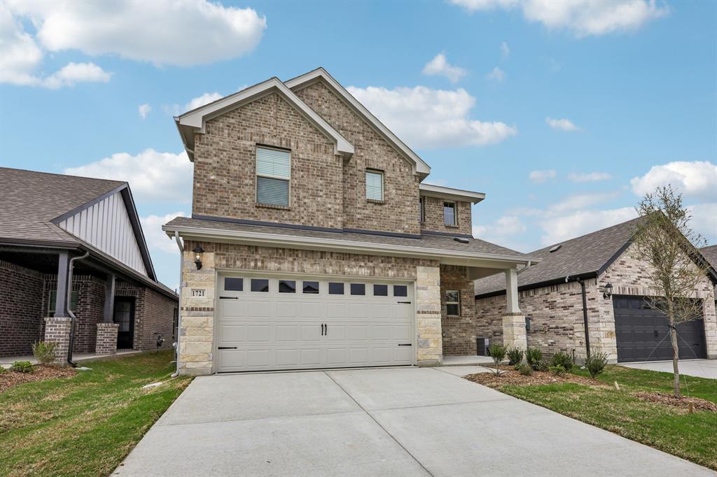 1721 Arches Road Anna, TX 75409 - Photo 2 of 39 a front view of a house with a garden and garage