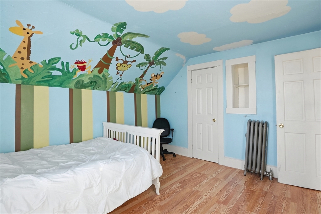 5 Ripley Place Worcester, MA 01610 - Photo 18 of 28 a bedroom with bed and wooden floor