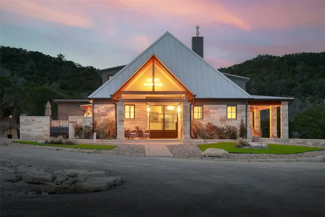a front view of house with yard and green space