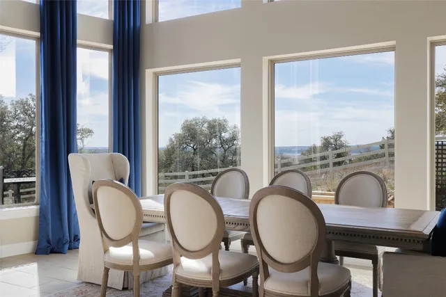 a table and chairs in a balcony