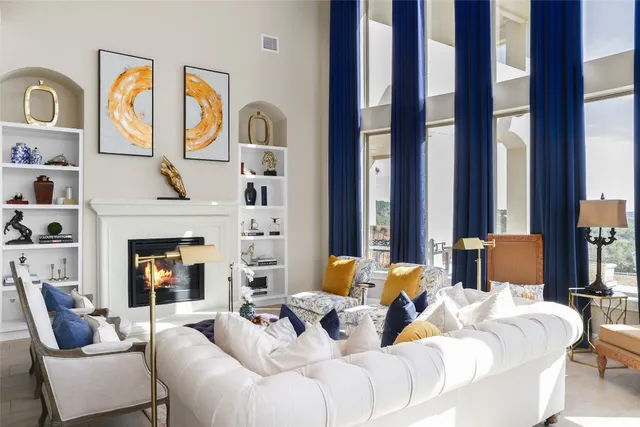 a living room with furniture fireplace and flat screen tv