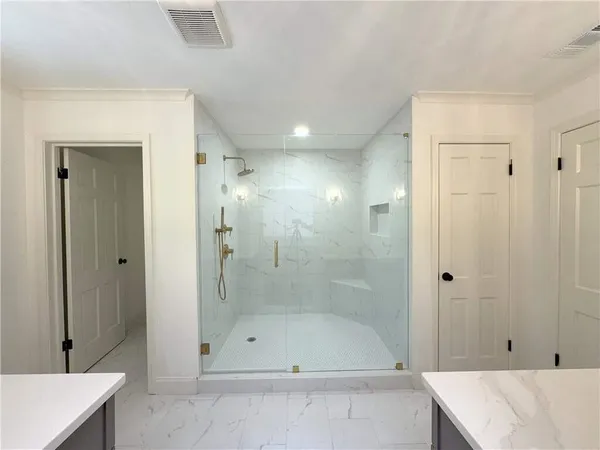 a bathroom with a sink double vanity and mirror