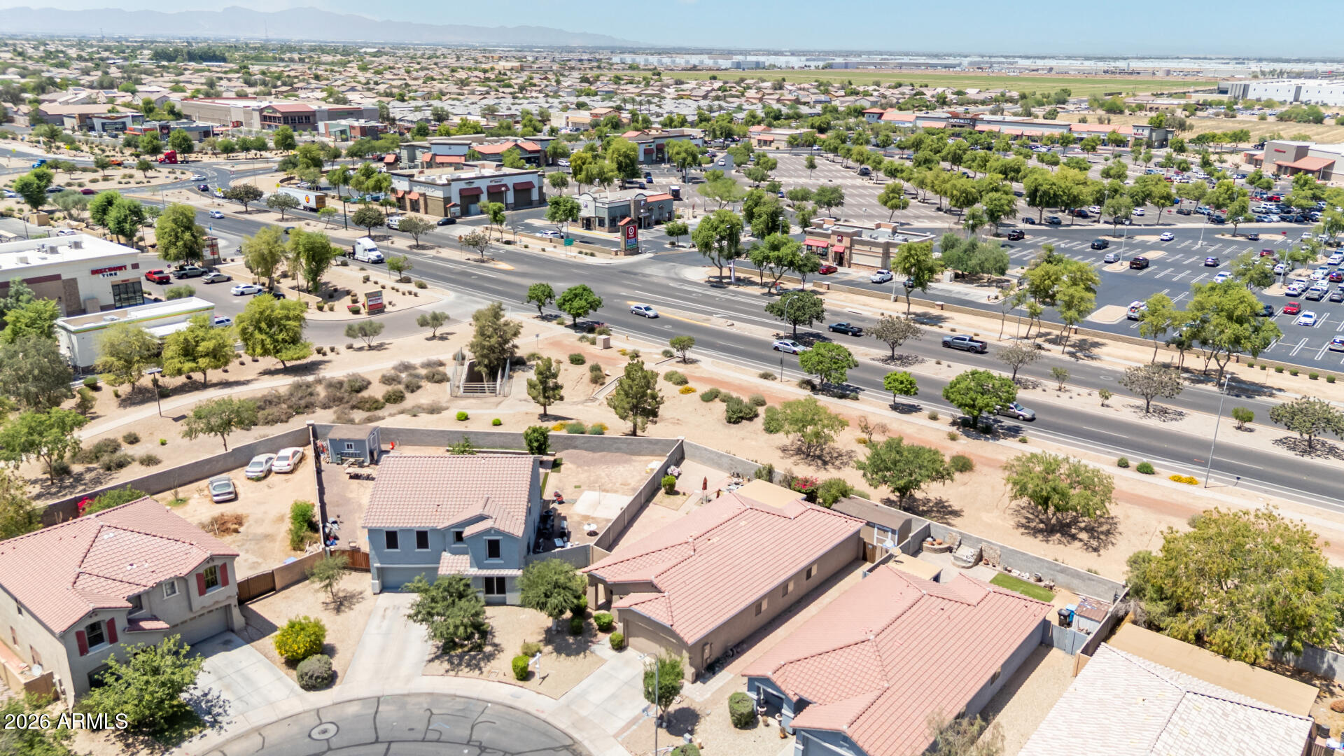 9730 West Payson Road Tolleson, AZ 85353 - Photo 38 of 57 an aerial view of a city with lots of residential buildings