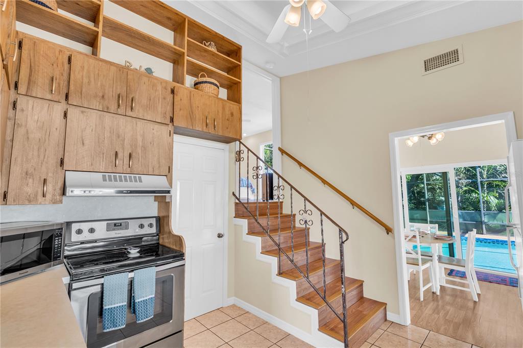 521 Pameto Road Nokomis, FL 34275 - Photo 11 of 41 a kitchen with stainless steel appliances granite countertop a stove and a refrigerator