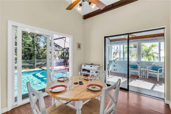 a view of a dining room with furniture window and wooden floor