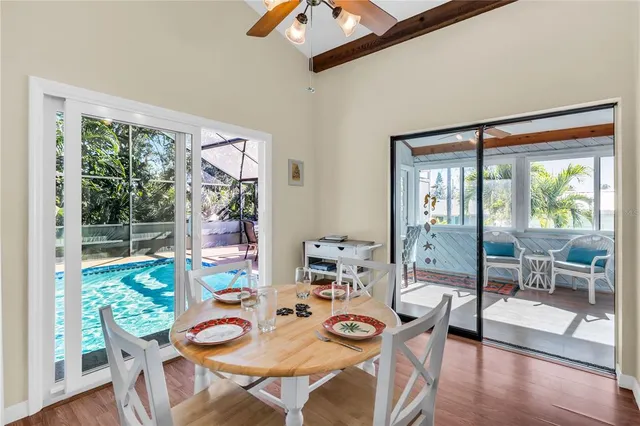 a view of a dining room with furniture window and wooden floor