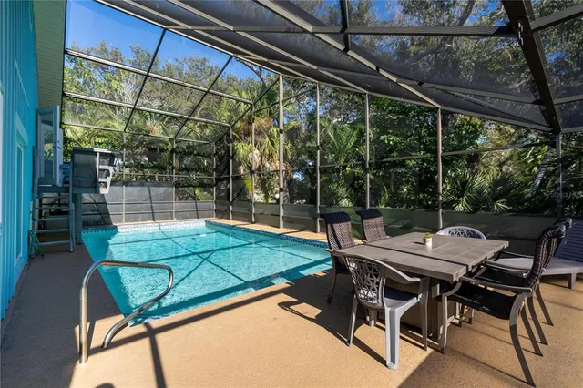 a view of a patio with a table and chairs