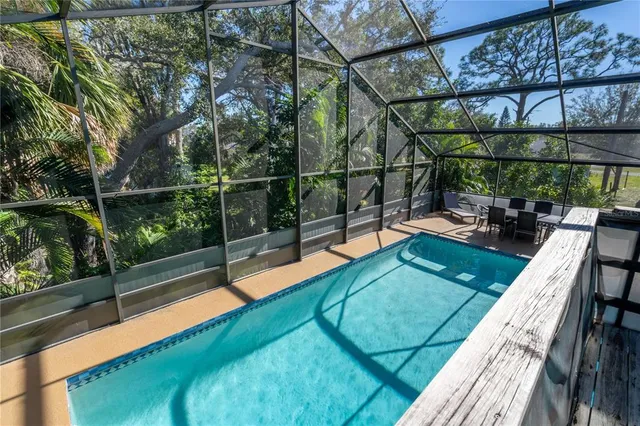 a view of swimming pool with a patio and a yard