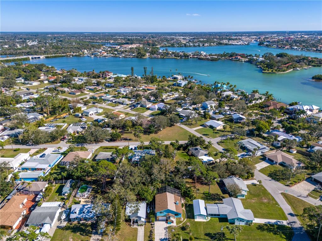 521 Pameto Road Nokomis, FL 34275 - Photo 32 of 41 an aerial view of city and lake with trees all around