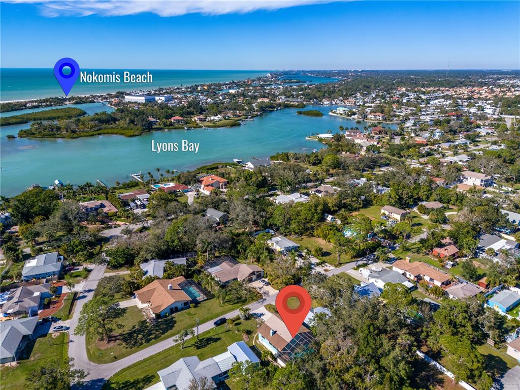 521 Pameto Road Nokomis, FL 34275 - Photo 35 of 41 an aerial view of residential houses with outdoor space and lake view