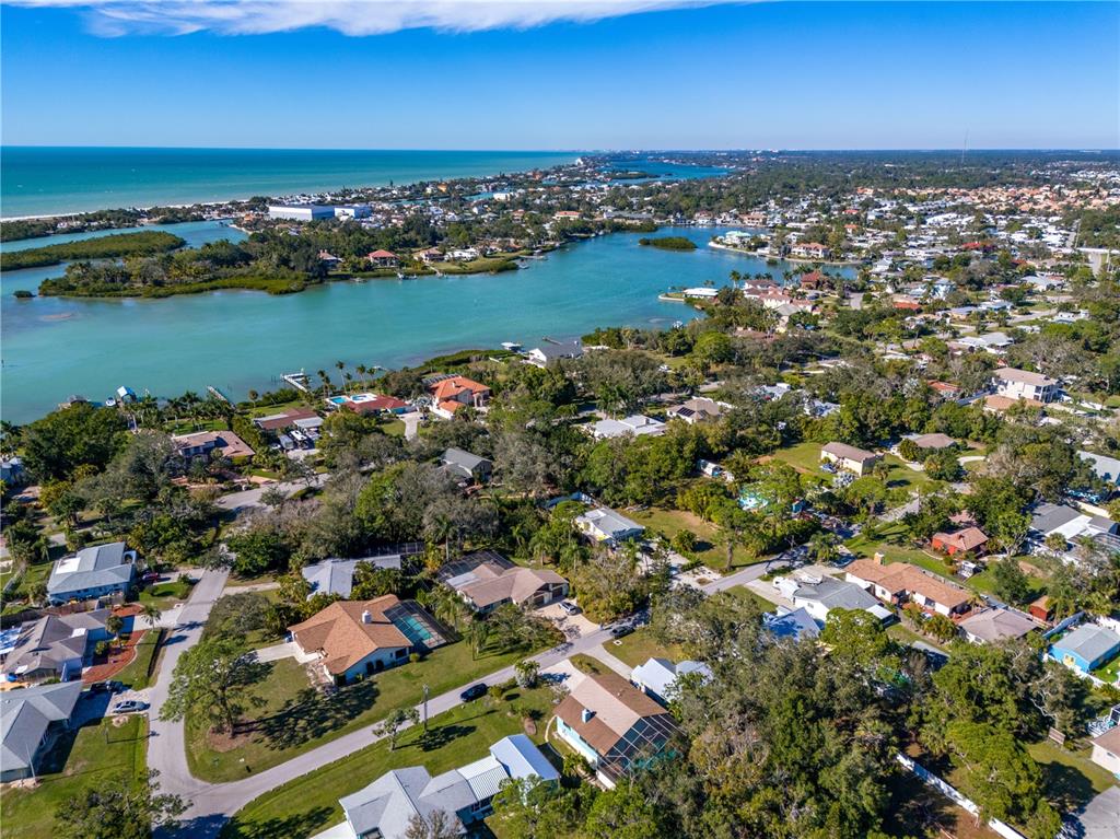 521 Pameto Road Nokomis, FL 34275 - Photo 36 of 41 an aerial view of a houses with a lake view
