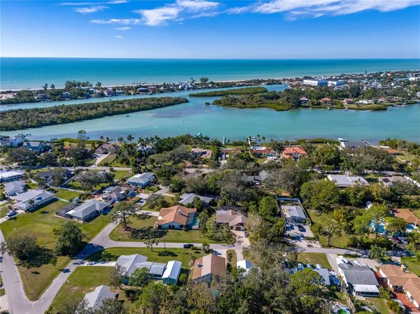 an aerial view of a houses with a swimming pool