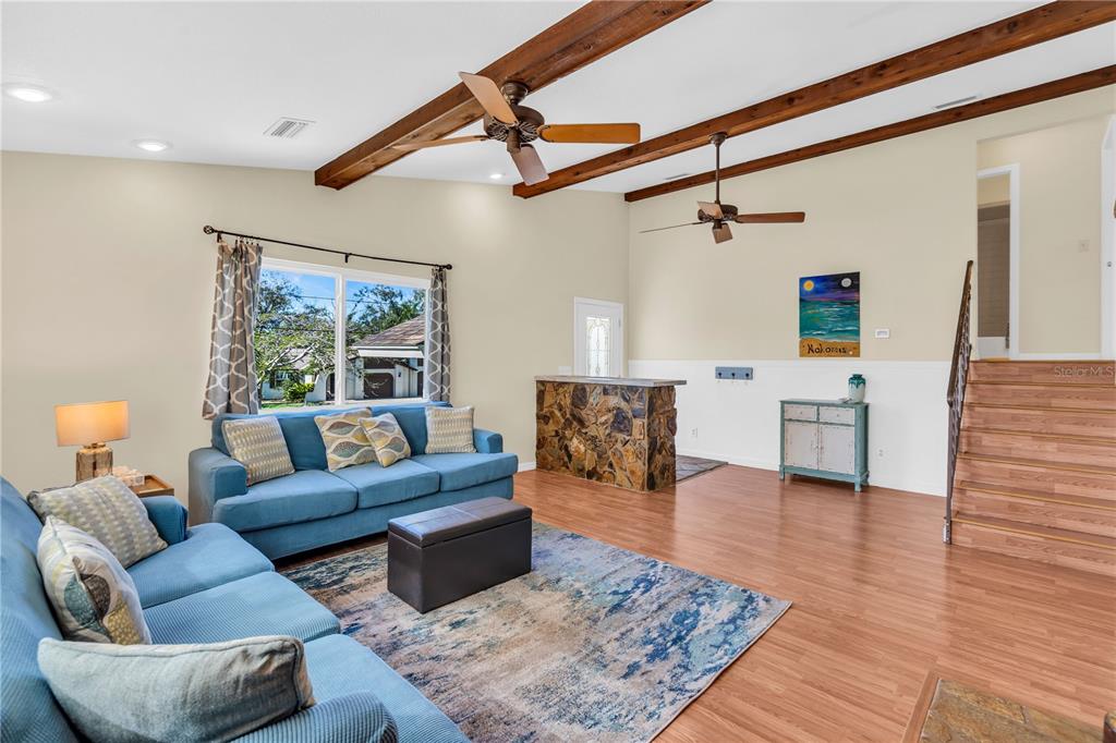 521 Pameto Road Nokomis, FL 34275 - Photo 4 of 41 a living room with furniture and a wooden floor