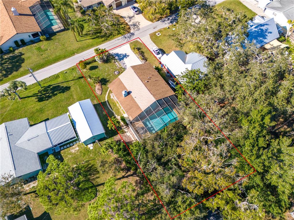 521 Pameto Road Nokomis, FL 34275 - Photo 41 of 41 an aerial view of a house with a yard and garden