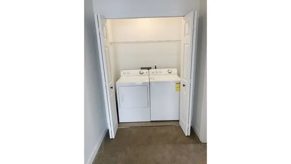 a bathroom with a tub shower and sink
