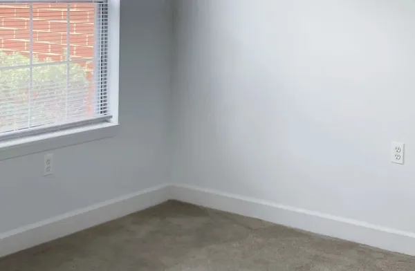 front view of a house with a tree