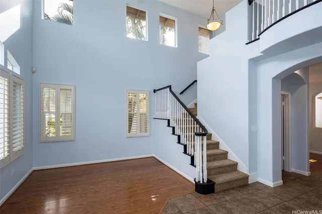 a view of entryway and hall with wooden floor
