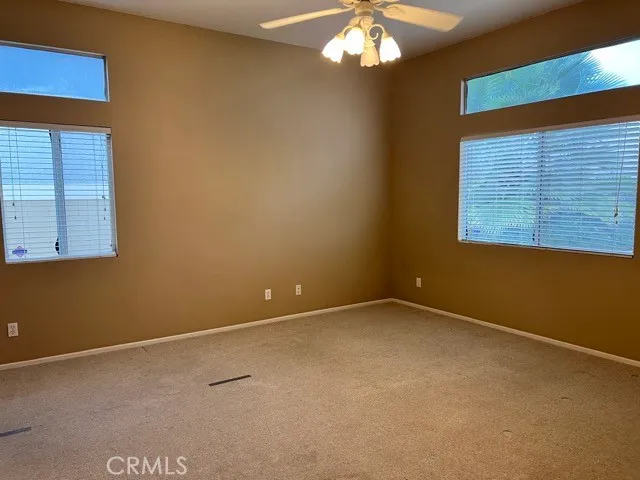 a bathroom with a glass door shower and a sink