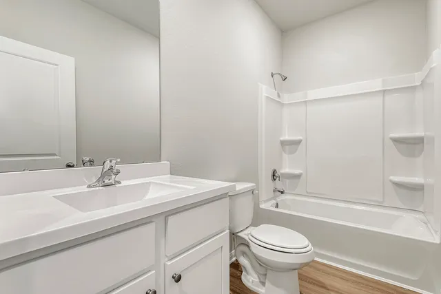 a bathroom with a sink a mirror and a bathtub