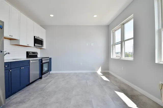 a kitchen with sink and microwave
