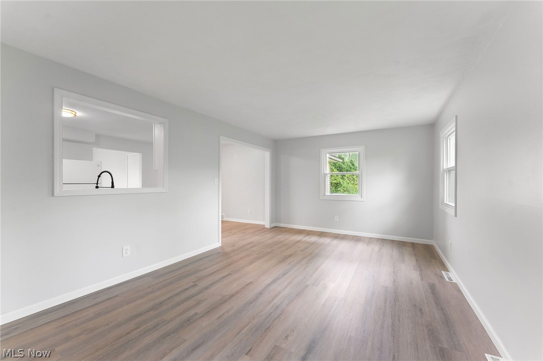 962 Keefer Road Girard, OH 44420 - Photo 12 of 31 Unfurnished room with wood-type flooring