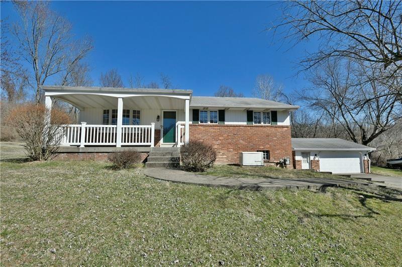 1298 Sugar Run Road Venetia, PA 15367 - Photo 1 of 28 a front view of a house with a yard