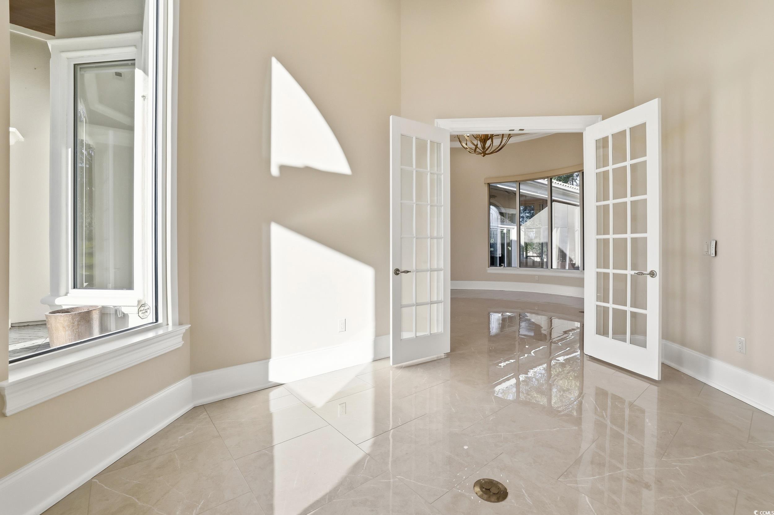 345 Posada Drive Myrtle Beach, SC 29572 - Photo 14 of 40 Office featuring french doors, a chandelier, and marble tiled floors