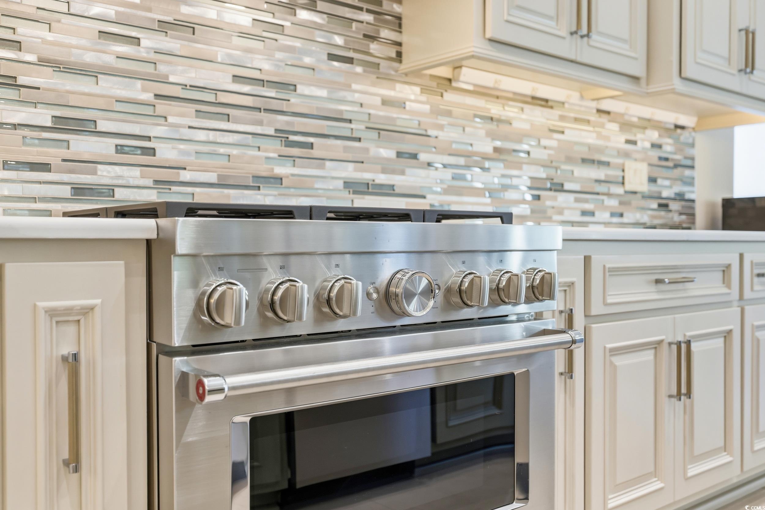 345 Posada Drive Myrtle Beach, SC 29572 - Photo 15 of 39 Kitchen view of high end stainless steel range oven, light countertops, and cream cabinetry