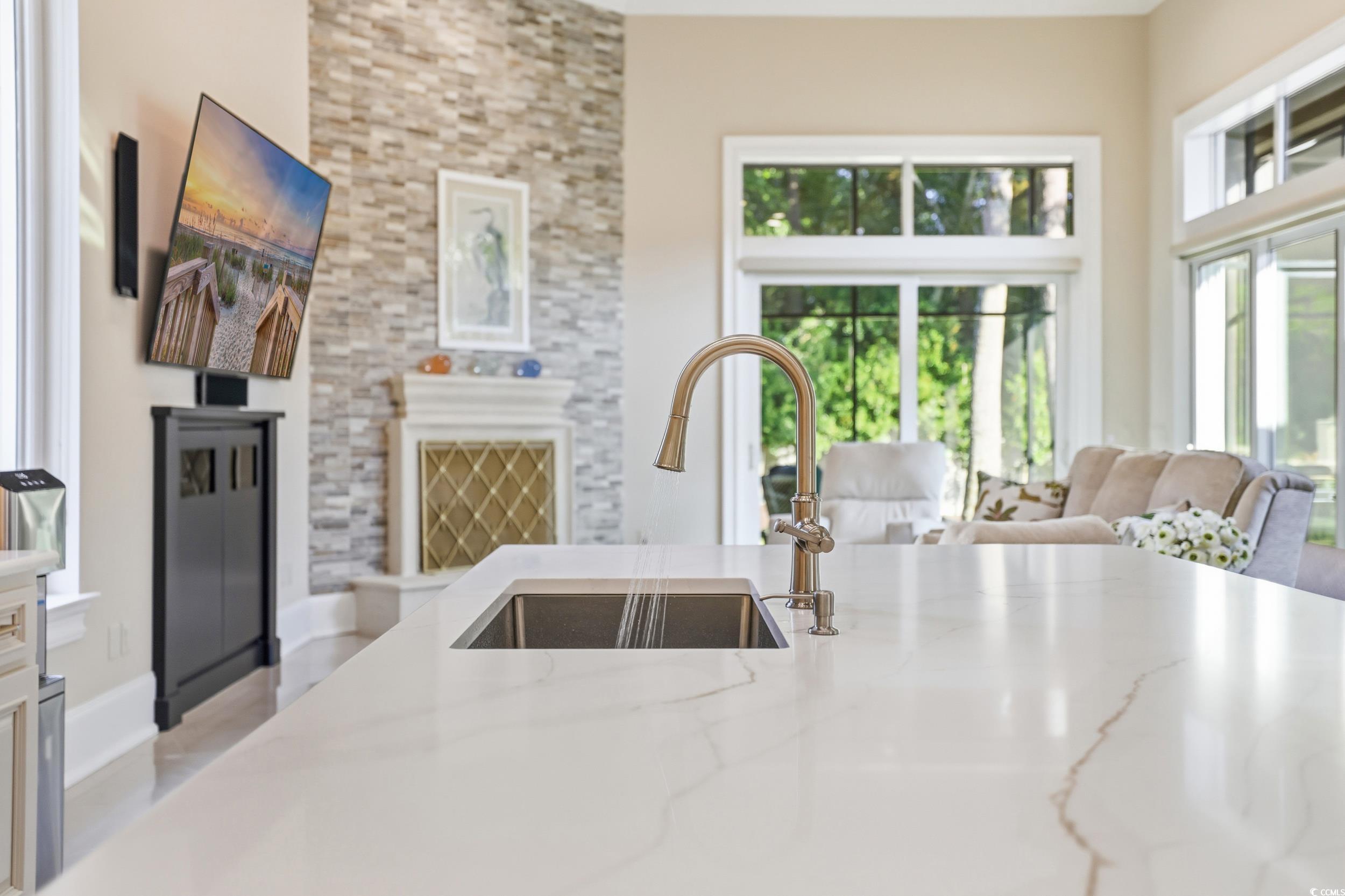 345 Posada Drive Myrtle Beach, SC 29572 - Photo 39 of 39 Family room and Kitchen with light stone counters and open floor plan