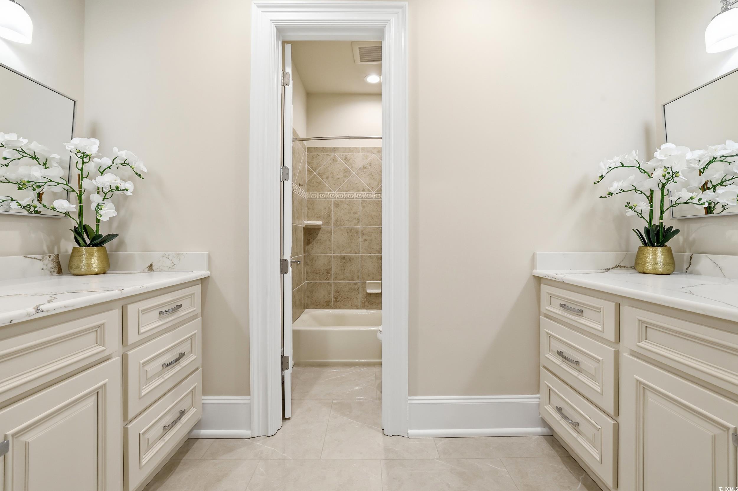 345 Posada Drive Myrtle Beach, SC 29572 - Photo 19 of 39 Bathroom featuring bathtub / shower combination, vanity, and light tile patterned floors