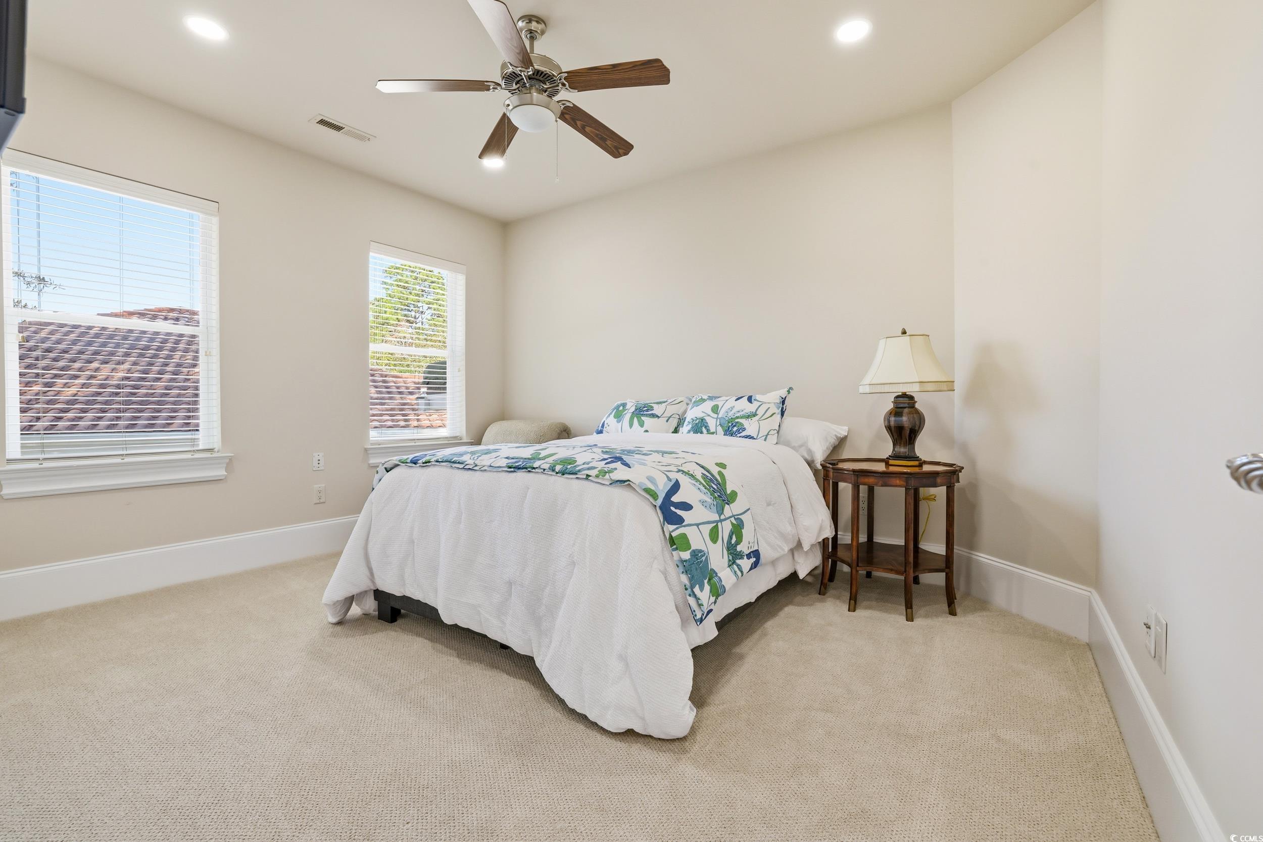 345 Posada Drive Myrtle Beach, SC 29572 - Photo 20 of 39 Bedroom with light colored carpet, a ceiling fan, and recessed lighting