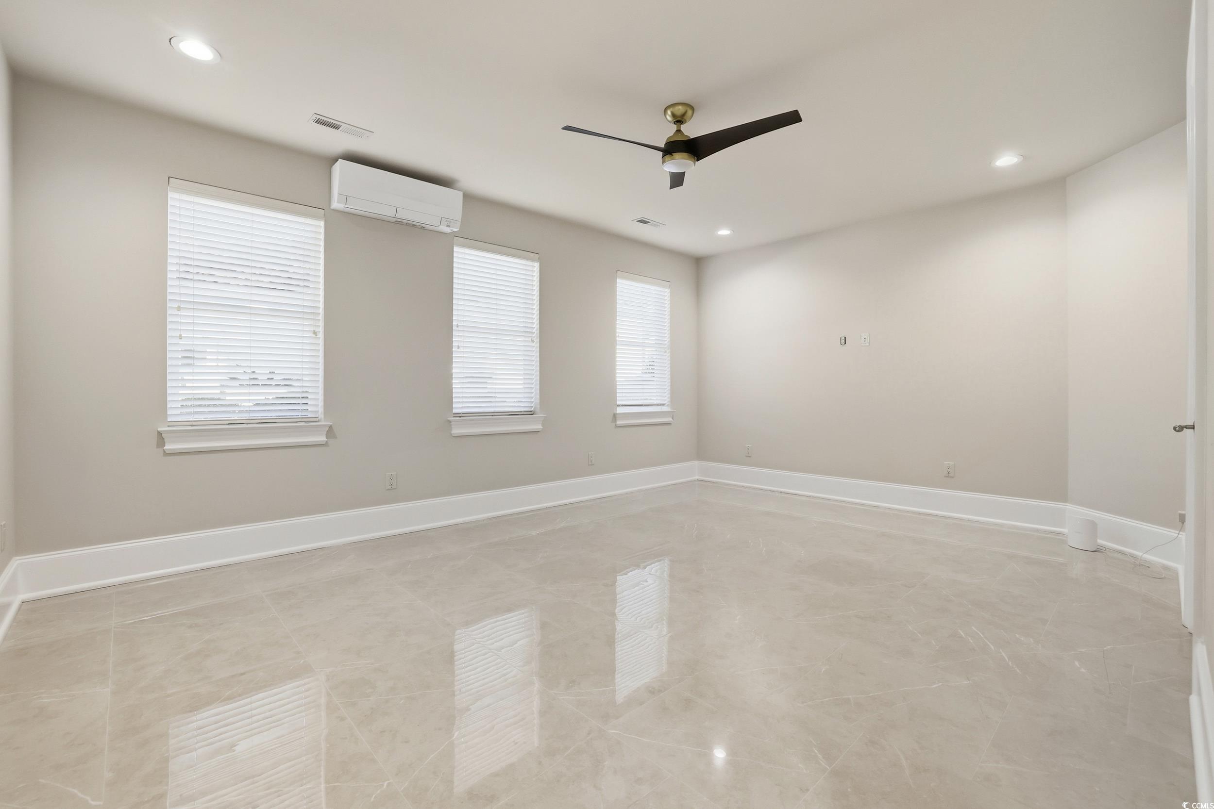 345 Posada Drive Myrtle Beach, SC 29572 - Photo 20 of 40 Empty room featuring recessed lighting, a wall mounted AC, and ceiling fan