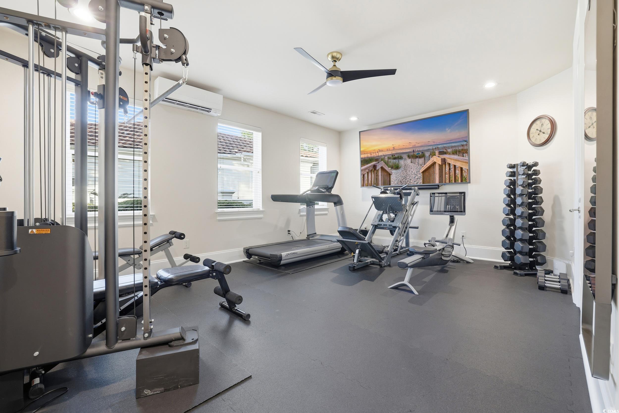345 Posada Drive Myrtle Beach, SC 29572 - Photo 22 of 39 Exercise area with a wall mounted AC, ceiling fan, and recessed lighting