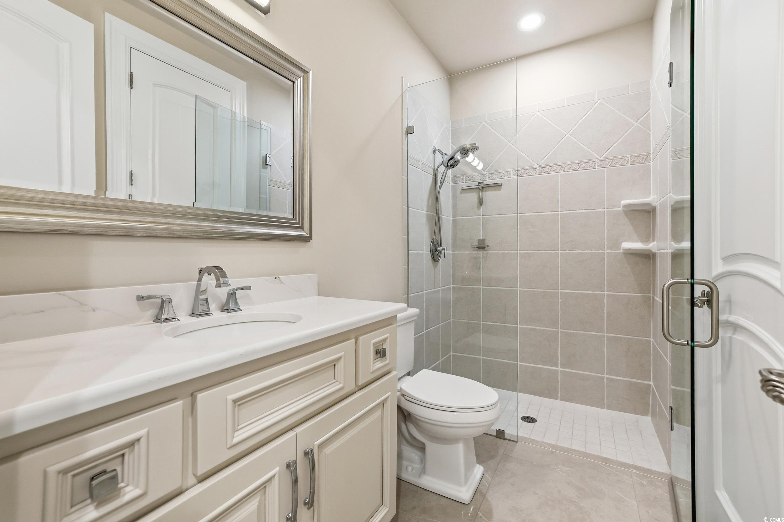 345 Posada Drive Myrtle Beach, SC 29572 - Photo 22 of 40 Full bath with vanity, a stall shower, and recessed lighting