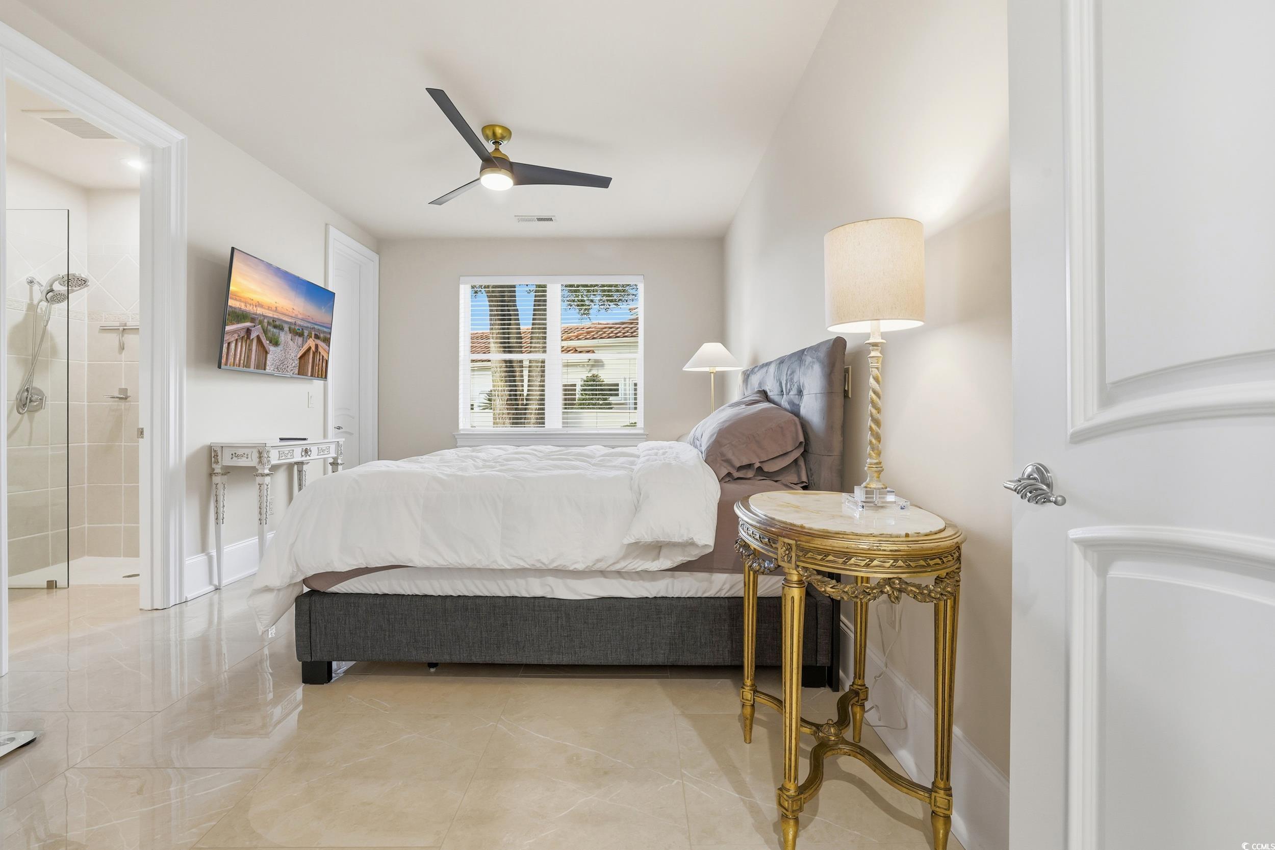 345 Posada Drive Myrtle Beach, SC 29572 - Photo 23 of 39 Tiled bedroom featuring a ceiling fan and ensuite bathroom
