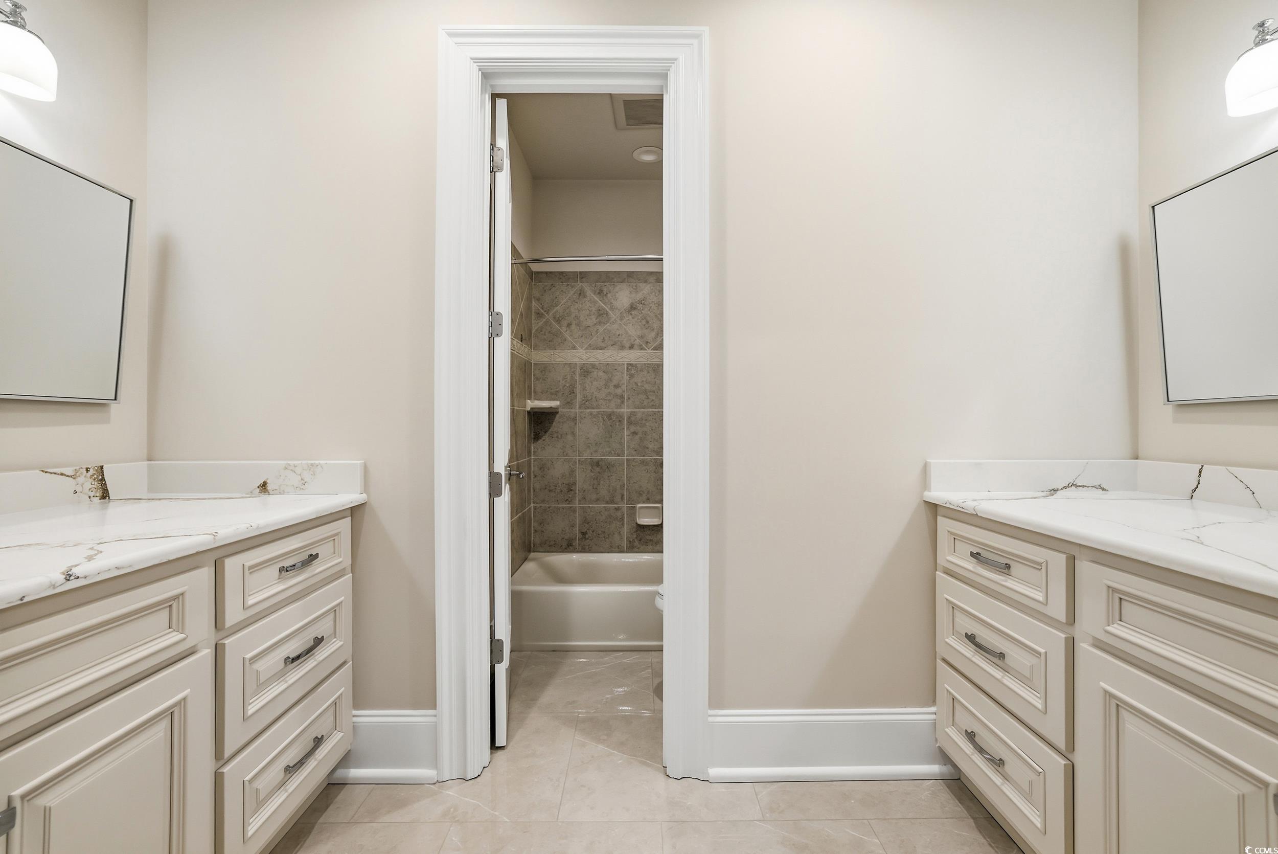 345 Posada Drive Myrtle Beach, SC 29572 - Photo 24 of 40 Bathroom with vanity, shower / tub combination, and light tile patterned flooring