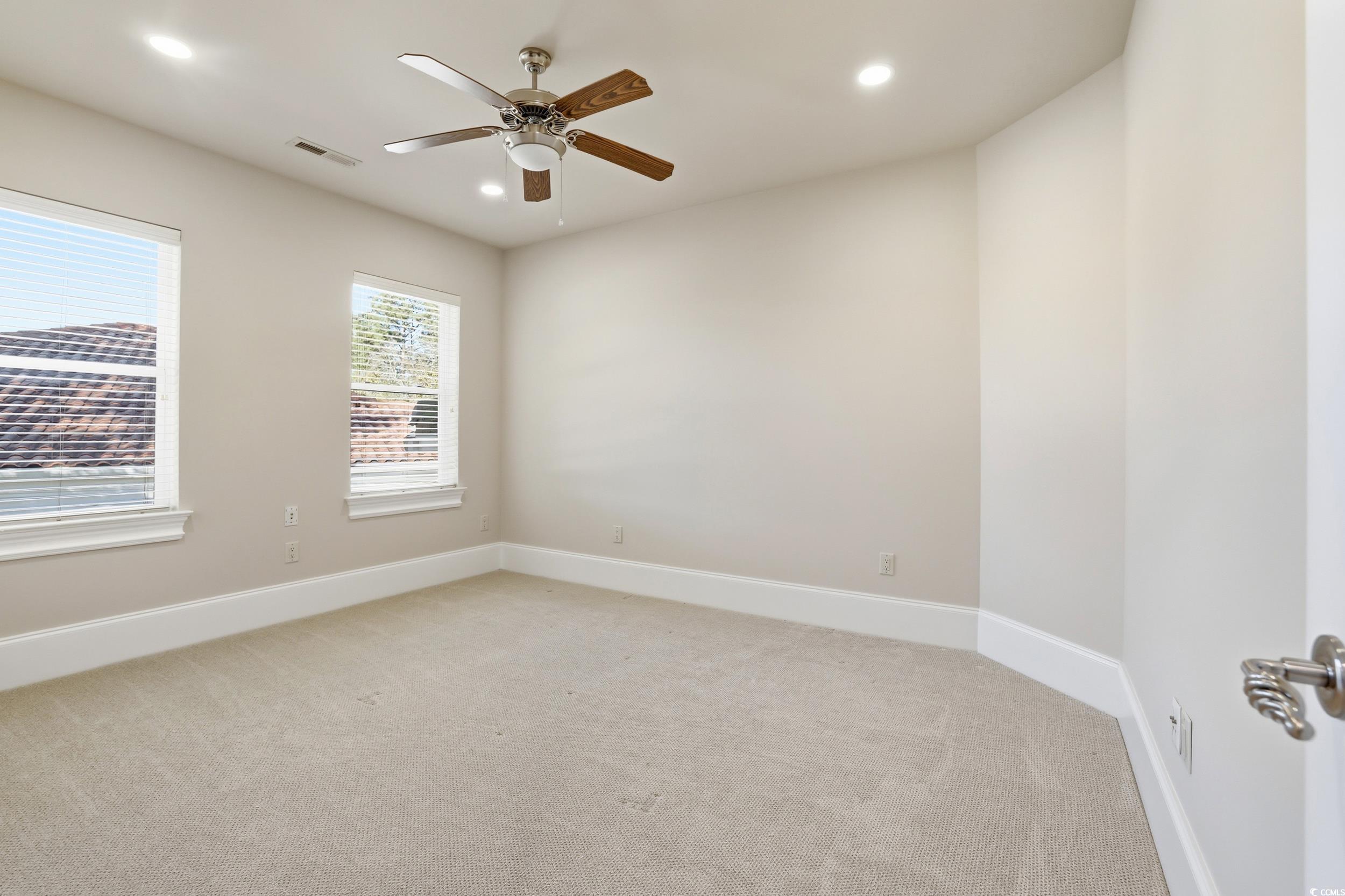 345 Posada Drive Myrtle Beach, SC 29572 - Photo 25 of 40 Guest room featuring light colored carpet, a ceiling fan, and recessed lighting