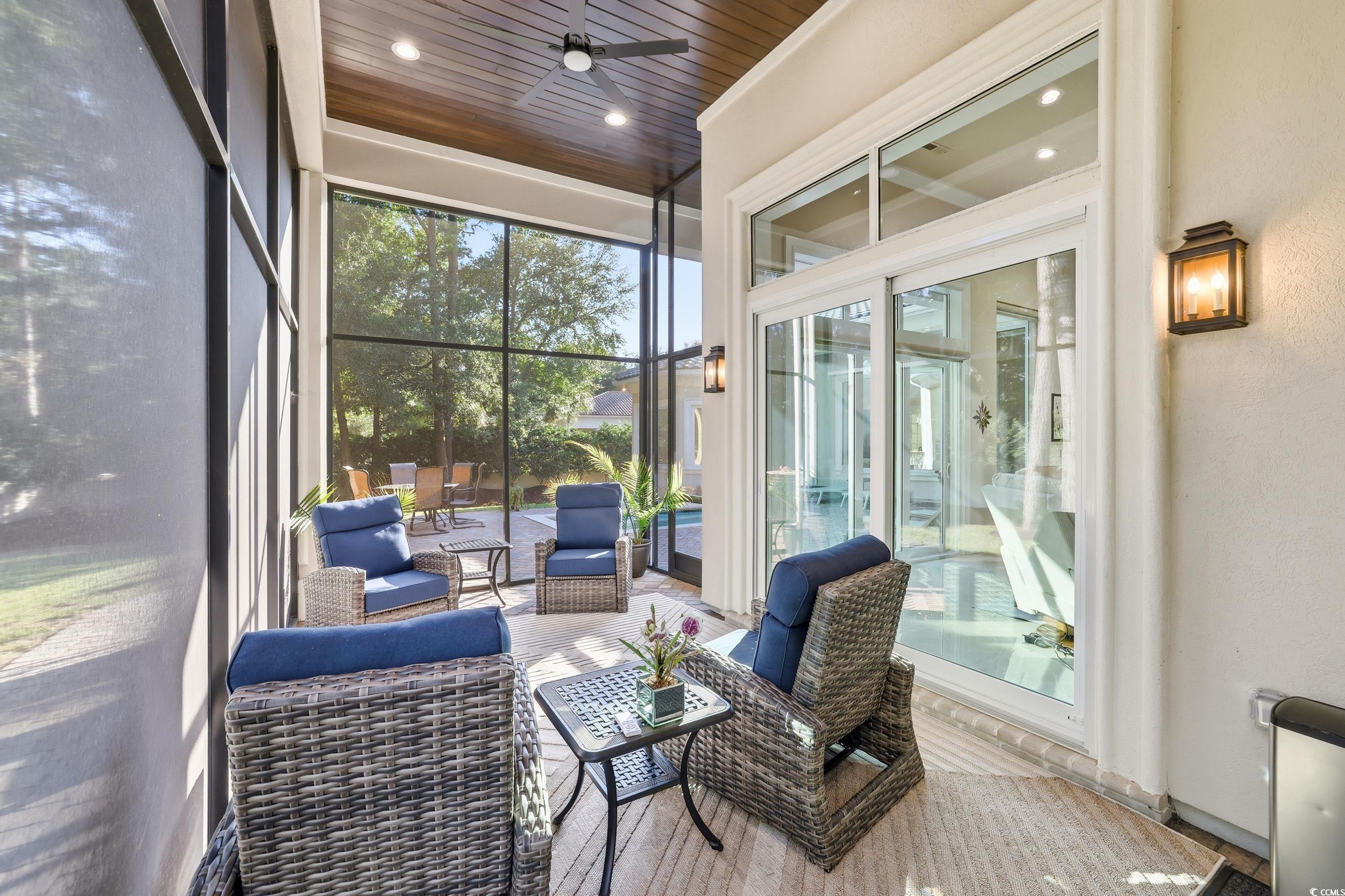 345 Posada Drive Myrtle Beach, SC 29572 - Photo 27 of 39 Screened Porch featuring ceiling fan and an outdoor living space 25 X 10 1/2