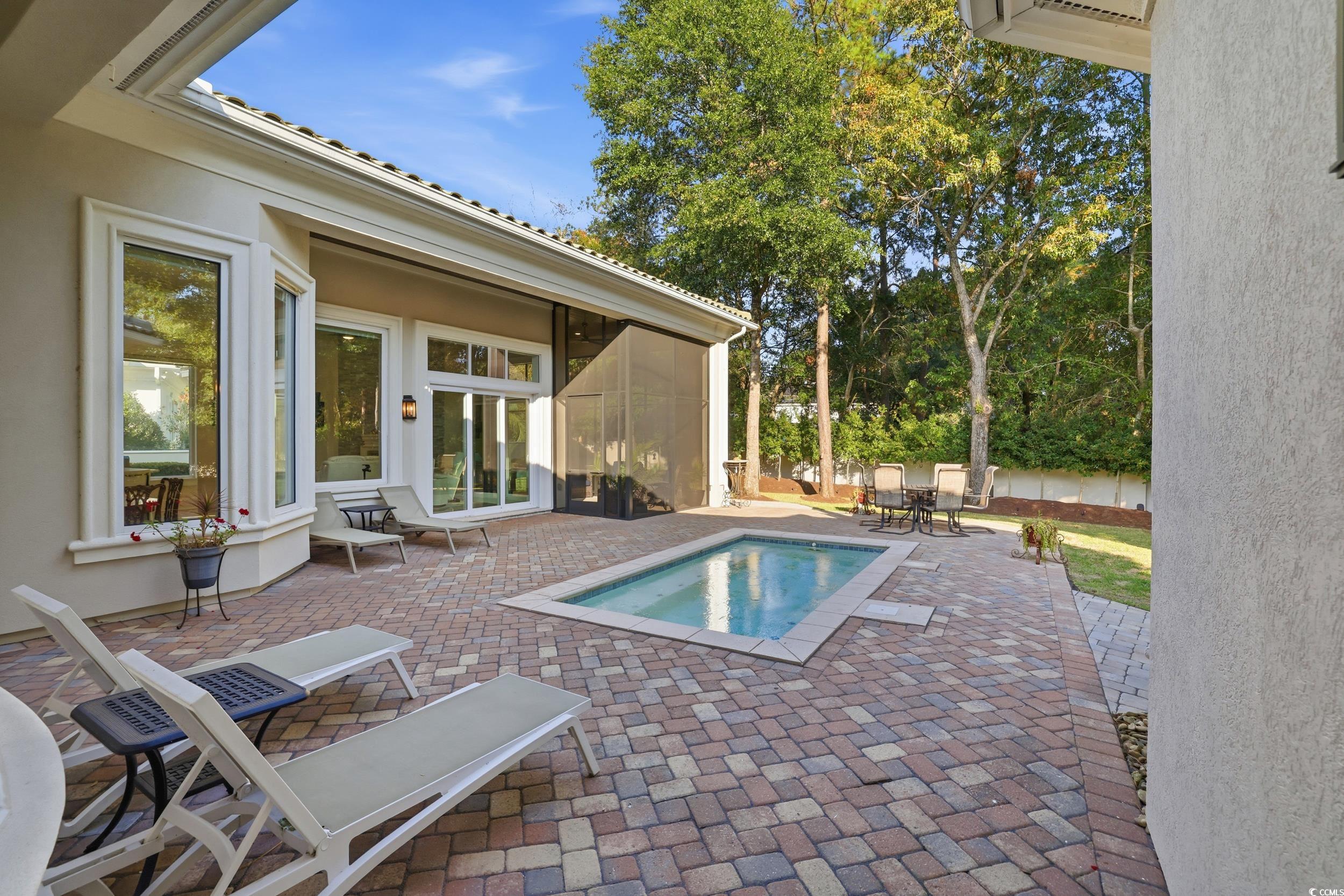 345 Posada Drive Myrtle Beach, SC 29572 - Photo 29 of 39 View of pool with a patio, a screened Porch and, and view of private wooded backyard
