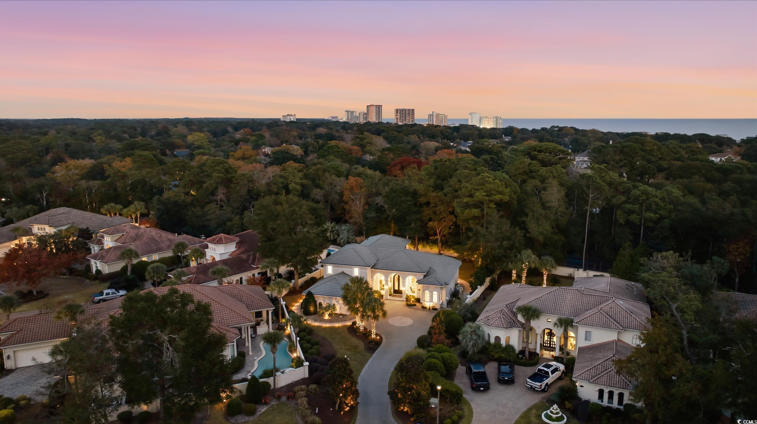 345 Posada Drive Myrtle Beach, SC 29572 - Photo 32 of 39 Aerial view at dusk of a view of trees and the ocean in the background
